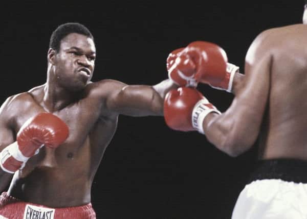 Larry Holmes in action against Muhammad Ali.