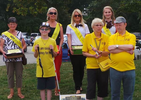 Ethan is pictured with members of the Peterborough Association for the Blind EMN-160824-105058001