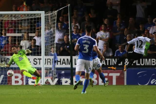 Mark Tyler of Peterborough United makes a save from Nathan Dyer of Swansea City. Picture: Joe Dent