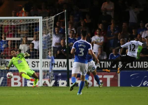 Mark Tyler of Peterborough United makes a save from Nathan Dyer of Swansea City. Picture: Joe Dent