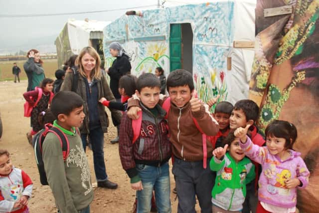 Outside one of the tent schools in Syrian refugee camps SUS-160601-093359003