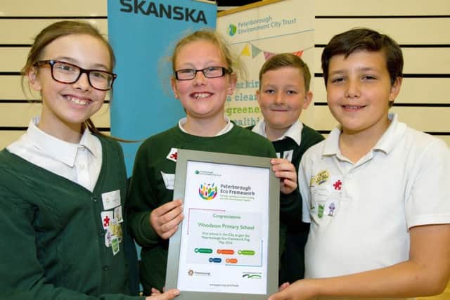 Pupils from Woodston Primary School receive their Peterborough Eco Framework cerificate EMN-160830-110739001