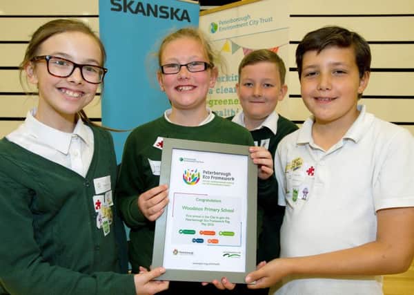 Pupils from Woodston Primary School receive their Peterborough Eco Framework cerificate EMN-160830-110739001