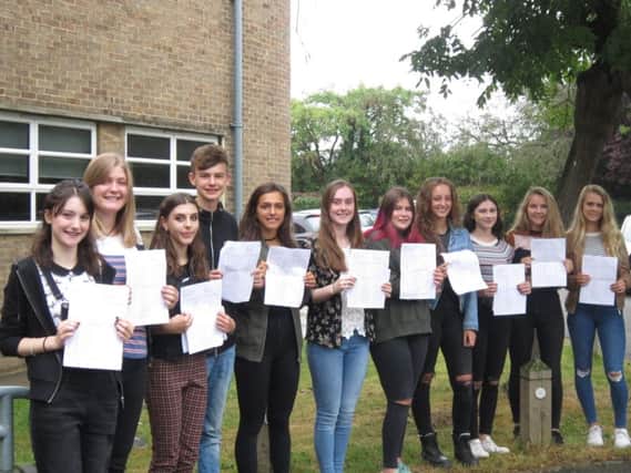 Pupils celebrate getting their GCSE results at Arthur Mellows Village College