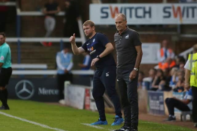 Posh boss Grant McCann on the touchline with Swansea manager Francesco Guidolin. Photo: Joe Dent/theposhcom.
