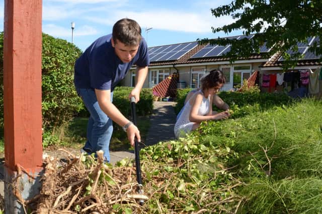 Youngsters taking part in National  Citizen Service at Hinchcliffe sheltered housing complex. (left) is  James Karas-Hassan EMN-160824-223044009