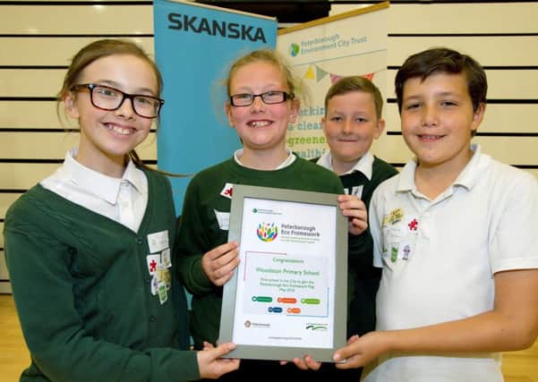 Woodston Primary receiving their Peterborough Eco Framework certificates