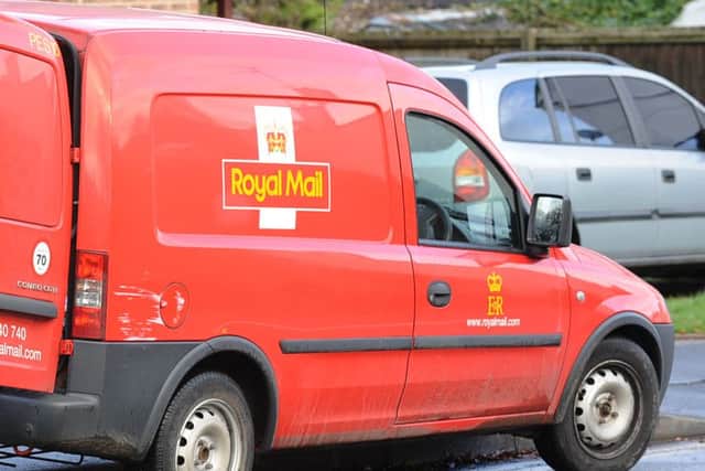 Royal Mail postman in North Street, Stanground ENGNNL00120130917143031