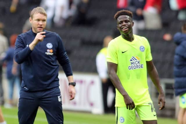 Young Posh midfielder Leo Da Silva Lopes is congratulated by Posh boss Grant McCann after the 2-0 ain at MK Dons. Photo: Joe Dent/theposh.com.