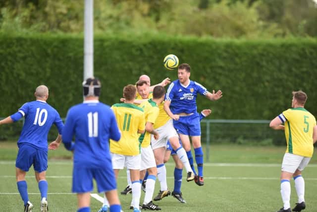 Action from AFC Stanground Sports (blue) 5, ICA Sports 1. Photo: David Lowndes.