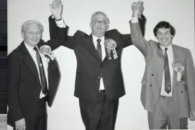 Neville Sanders (centre)