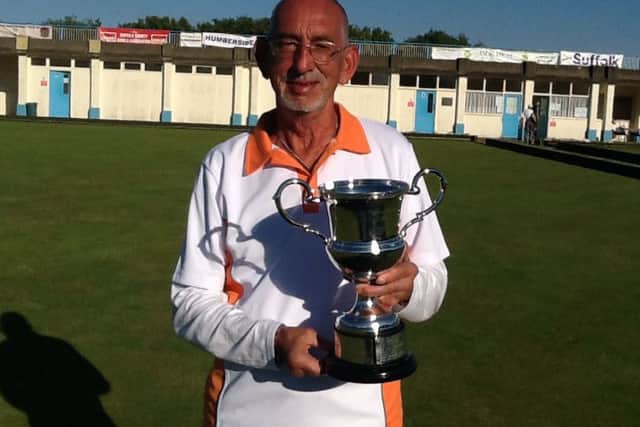 Veteran singles champion Mick Duell with his trophy.
