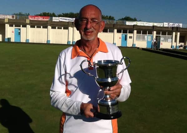 Veteran singles champion Mick Duell with his trophy.
