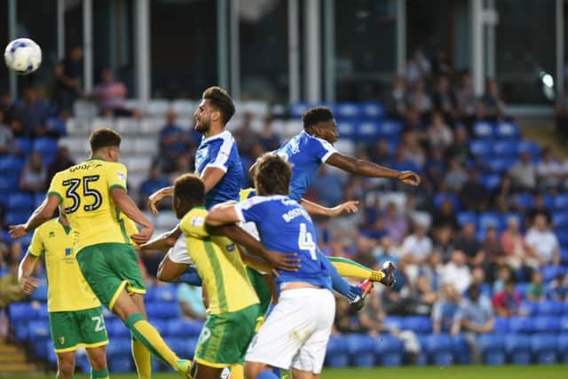 An aerial duel during the Checkatrade Trophy tie between Posh and Norwich. Photo: David Lowndes.