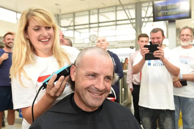 British Rail train drivers who are having their heads shaved by hairdresser Hayley Hindle in aid of Katie Rickett Pictured is Paul Andrews. EMN-160831-214041009