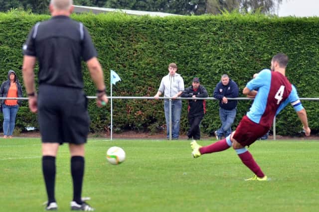 David Burton-Jones scores from the penalty spot for Deeping Rangers against Gresley. Photo: Tim Wilson.