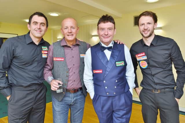 Pictured at last night's big snooker event at the Cresset are from the left Ronnie O'Sullivan, organiser Lord Russell Baker of Amber Dew Events, Jimmy White and Judd Trump. Picture: David Lowndes