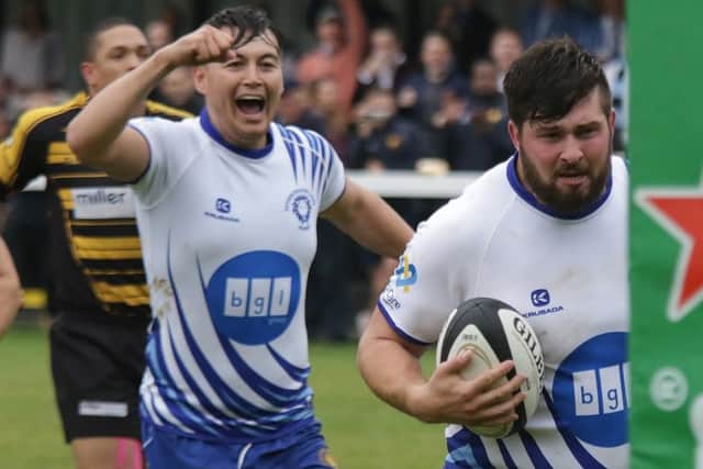 Kaz Henderson celebrates after Ben Howerd (right) had scored the second Lions try. Picture: Mick Sutterby