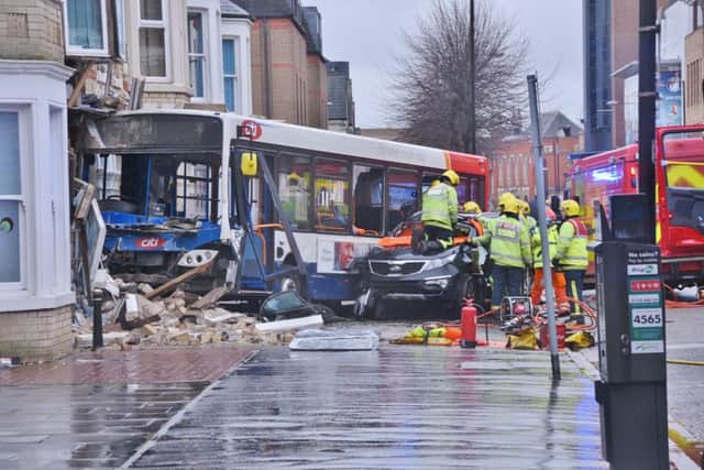 RTC involving a car and bus in Broadway, Peterborough City Centre. Bus collided with building, person trapped in the car involved. EMN-151224-145628009
