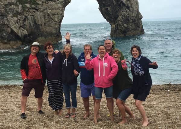 Nicola Guise is pictured with her fellow swimmers at Brownsea Island EMN-160709-115944001