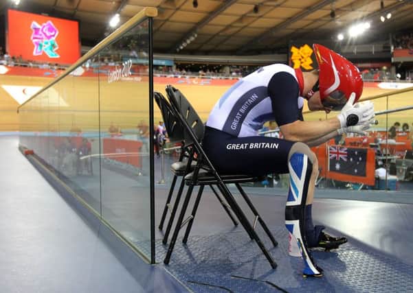 Great Britain's Jody Cundy reacts after learning he may have been disqualified from the Men's Individual C4-5 1km Time Trial Final at the Velodrome in the Olympic Park, London, in August 2012