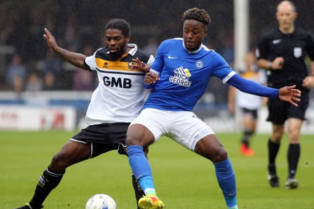 Jermaine Anderson of Peterborough United takes on Anthony Grant of Port Vale - Mandatory by-line: Peterborough United Football Club Ltd / PaperPix- 2016 - 16/17 - FOOTBALL - ABAX Stadium - Peterborough, Cambs - Peterborough United v Port Vale