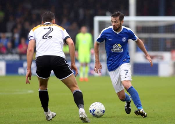 Gwion Edwards of Peterborough United takes on Ben Purkiss of Port Vale  - Mandatory by-line: Peterborough United Football Club Ltd / PaperPix- 2016 - 16/17 - FOOTBALL - ABAX Stadium - Peterborough, Cambs - Peterborough United v Port Vale