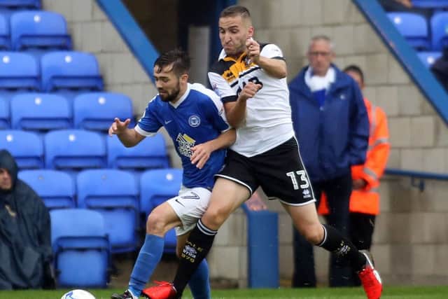 Gwion Edwards of Peterborough United tackles Martin Paterson of Port Vale  - Mandatory by-line: Peterborough United Football Club Ltd / PaperPix- 2016 - 16/17 - FOOTBALL - ABAX Stadium - Peterborough, Cambs - Peterborough United v Port Vale