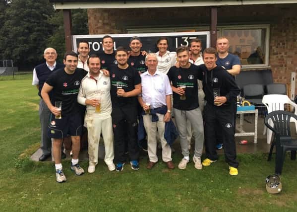 March Town cricketers after their title-winning success at Fodham.