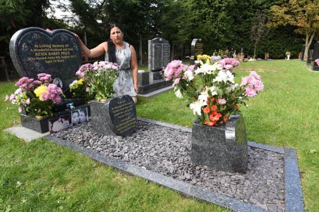 Janet Price of Eye at her husband's grave. She is  having problems with the oarish council over details of the grave EMN-161009-181836009