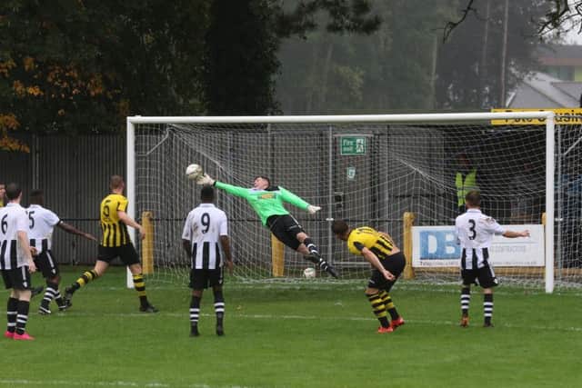 Peterborough Northern Star goalkeeper Dan George makes a great save during the game at Holbeach. Photo: Tim Gates.