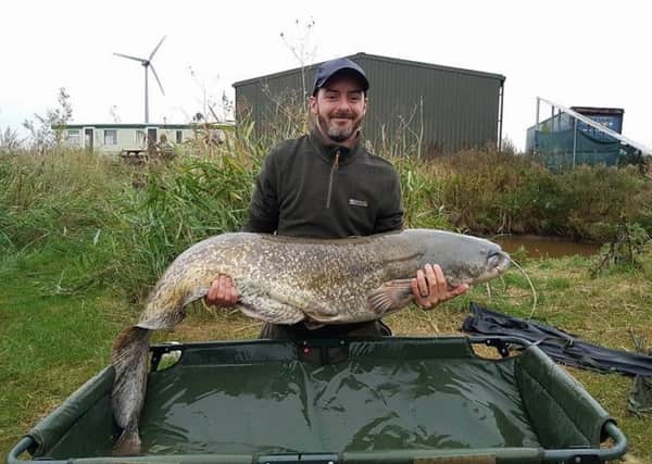 Mac Johnson with his huge catfish.