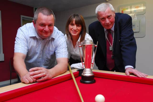 Ron Nesbitt is pictured at the donation of a new pool table  to the Young Persons Foyer in Peterborough by Steve Drinkwater. Ron was chairman of the Axiom Residents Association at the time and Carly Smith was the European ladies champion. From the left are Steve Drinkwater, Carly Smith and Ron Nesbitt.