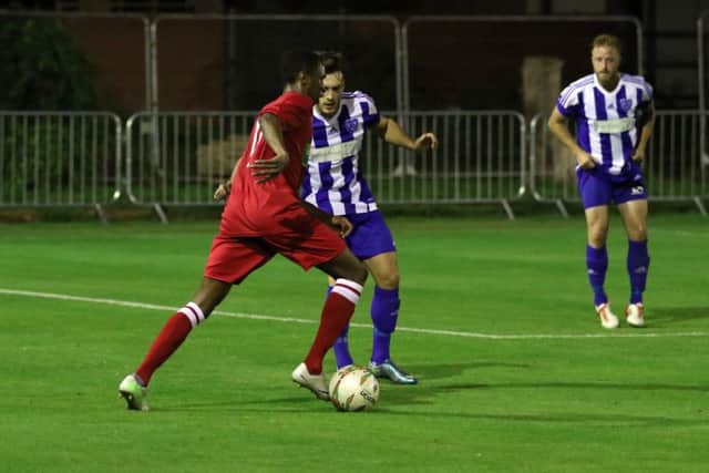 Laureno Da Silva (red) on the ball for Peterborough Northern Star at Eynesbury. Photo: Tim Gates.