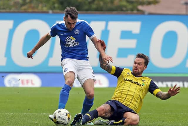 Posh full-back Michael Smith (left) in action at Oxford recently. Photo: Joe Dent/theposh.com.