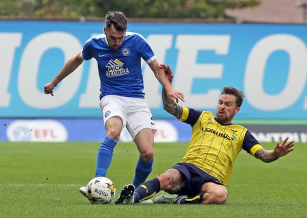 Posh full-back Michael Smith (left) in action at Oxford recently. Photo: Joe Dent/theposh.com.