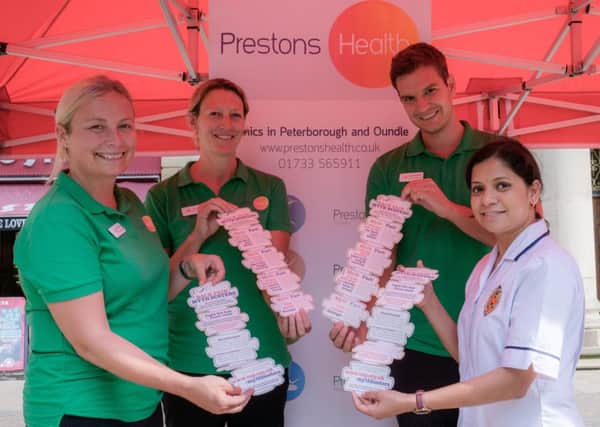 Leading city physiotherapist Helen Preston (left) and her team at the mysthbusting back pain campaign on Bridge Street.