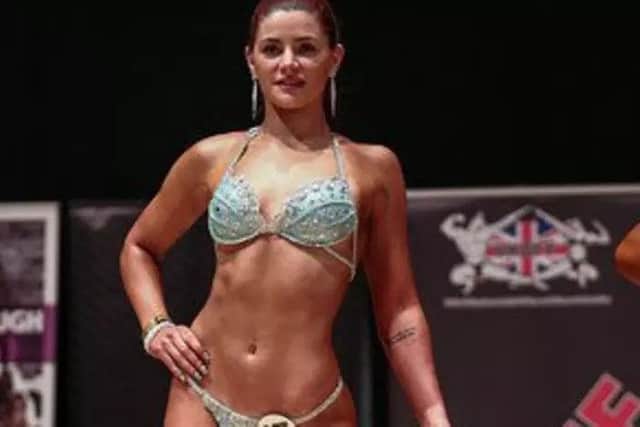 Erin competing in a bodybuilding contest