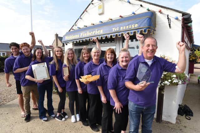 Martin Mills (right) and his staff at Weldon's Fisheries at Eye - winner of the PT Chip Shop of the Year comp EMN-160921-151530009
