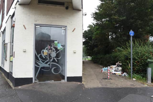 Fly tipping at the side of closed restaurant at Broadway with Cawthorne road recreation ground behind EMN-160919-171218009