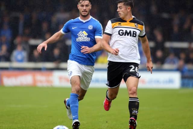 Andrew Hughes (left) should be back in the Posh starting line-up for the visit of Walsall. Photo: Joe Dent/theposh.com.