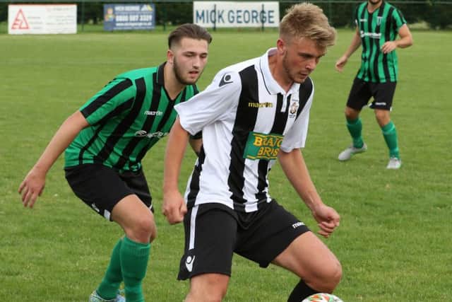 Jake Sansby in FA Vase action for Peterborough Northern Star against Blackstones. Photo: Tim Gates.