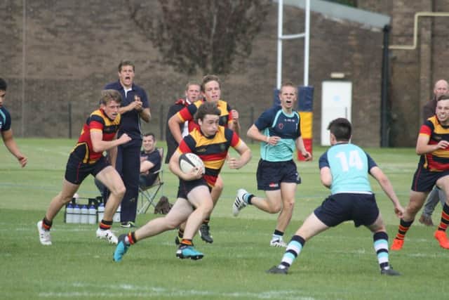 George Lemon attacks for Wisbech Grammar School.
