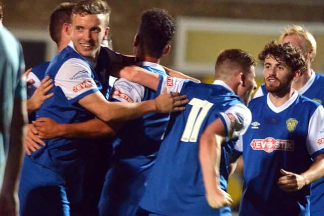 Spalding United celebrate their second goal in a 3-1 win over Rugby. Photo: Tim Wilson.