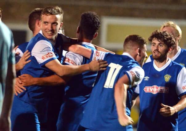 Spalding United celebrate their second goal in a 3-1 win over Rugby. Photo: Tim Wilson.