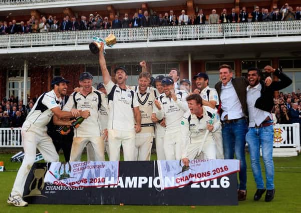 Middlesex players celebrate their County Championship title.