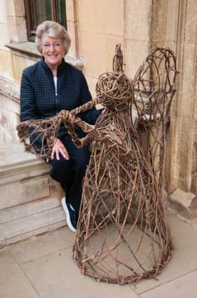 Lady Victoria Leatham with one of the wicker angels at Thorpe Hall Photo: Tim Sandall EMN-160915-171636001