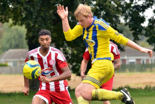 Action from Peterborough Sports Reserves (red) 4-1 win at Moulton Harrox. Photo: Tim Wilson.