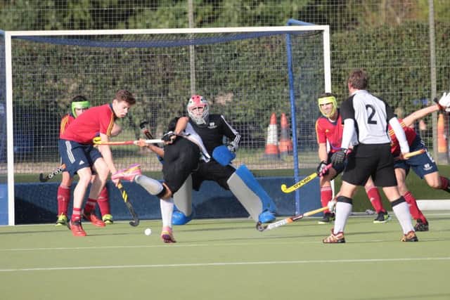 City of Peterborough goalkeeper Cameron Goodey and his defence during a 4-3 win at Harleston.