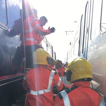 The passengers being evacuated - photo:  Cambridgeshire Fire and Rescue Service